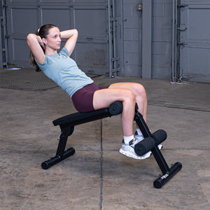 Best Fitness BFAB10B AB Folding Bench — decline sit-up at the top of the rep, feet secured under the foam rollers