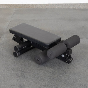 Best Fitness BFAB10B AB Folding Bench set up on the gym floor, rear three-quarter view showing the foam foot rollers
