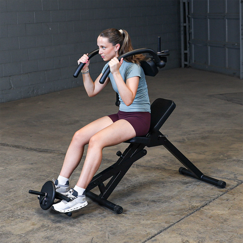 Best Fitness BFAB20B AB Mantis Bench — weighted ab crunch seen from behind, showing the arm pads and handle grips