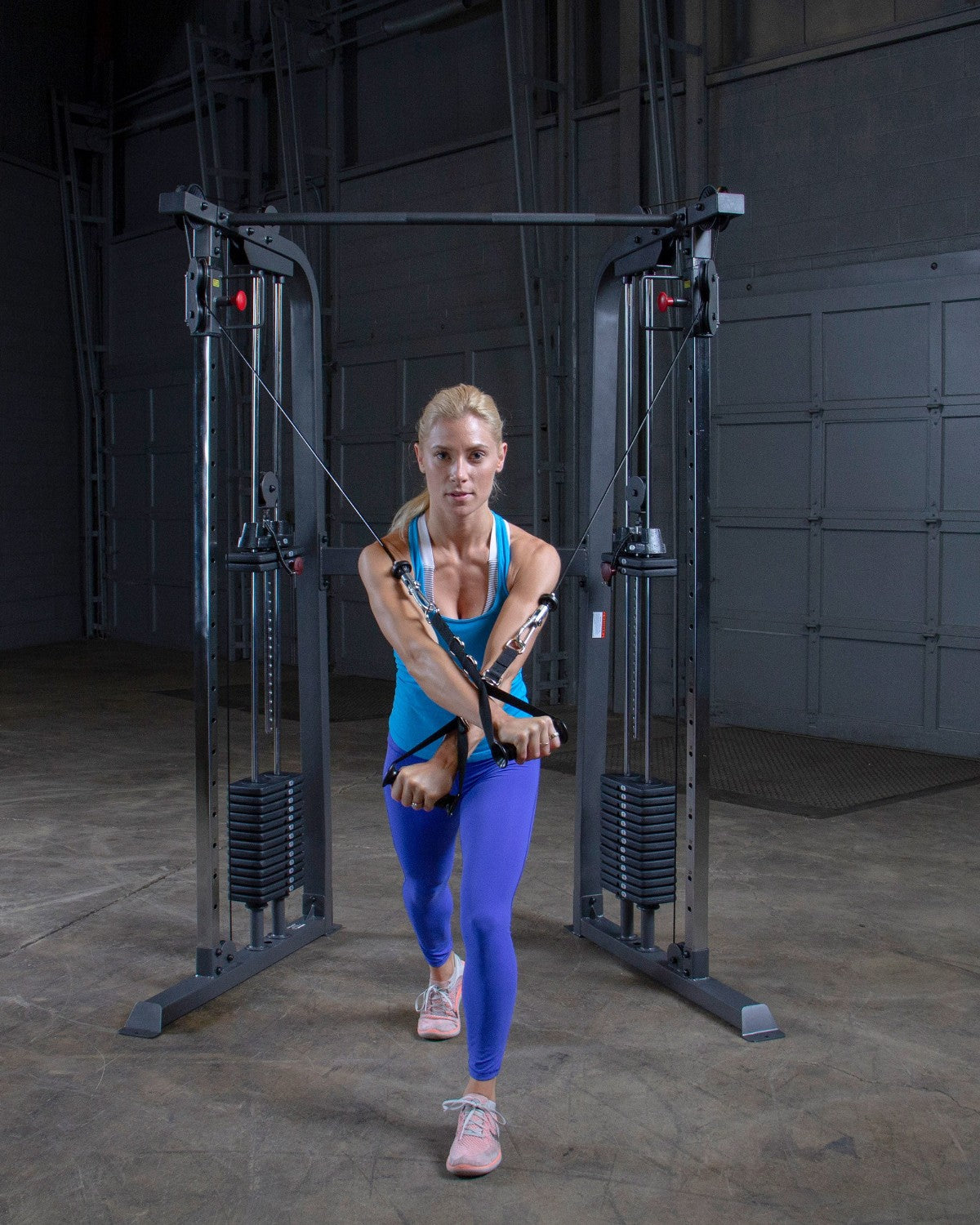 Standing cable crossover on the Powerline PFT100X functional trainer