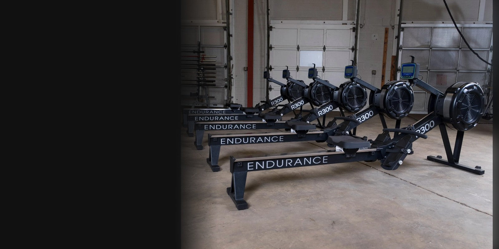 Row of Endurance R300 air rowers in a gym