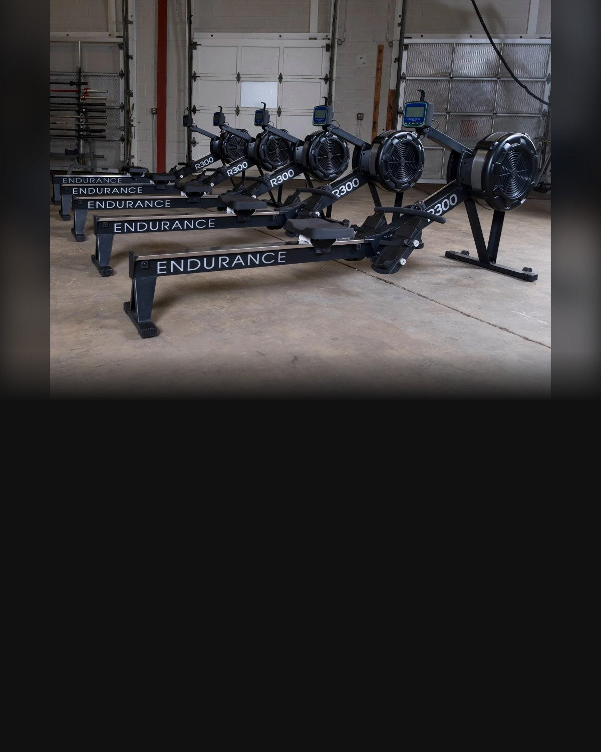 Row of Endurance R300 air rowers in a gym