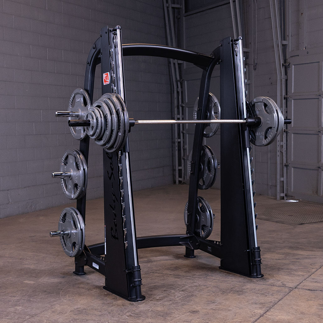 Body-Solid SCB1000B Counterbalanced Smith Machine loaded with Olympic plates on the six storage posts