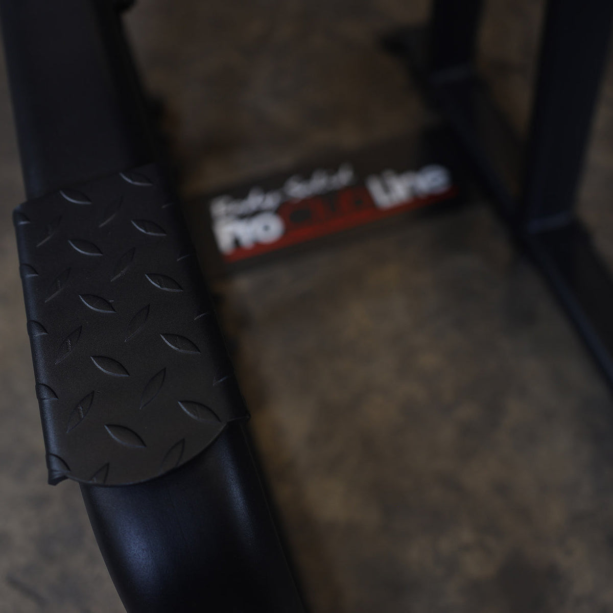 Body-Solid SVKR1000B Pro ClubLine Vertical Knee Raise — diamond-plate entry step and Pro ClubLine base