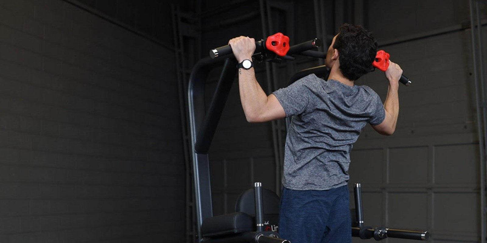Pull-ups on the Body-Solid Pro ClubLine SVKR1000B vertical knee raise, dip and pull-up tower