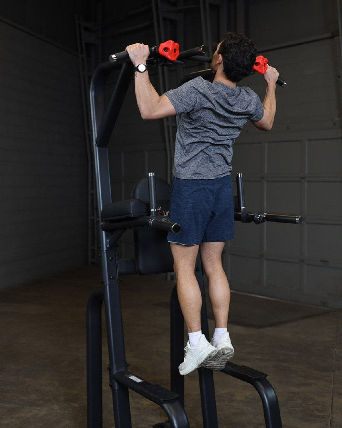 Pull-ups on the Body-Solid Pro ClubLine SVKR1000B vertical knee raise, dip and pull-up tower